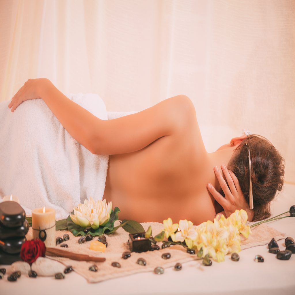 Relaxed lady after back massage treatment